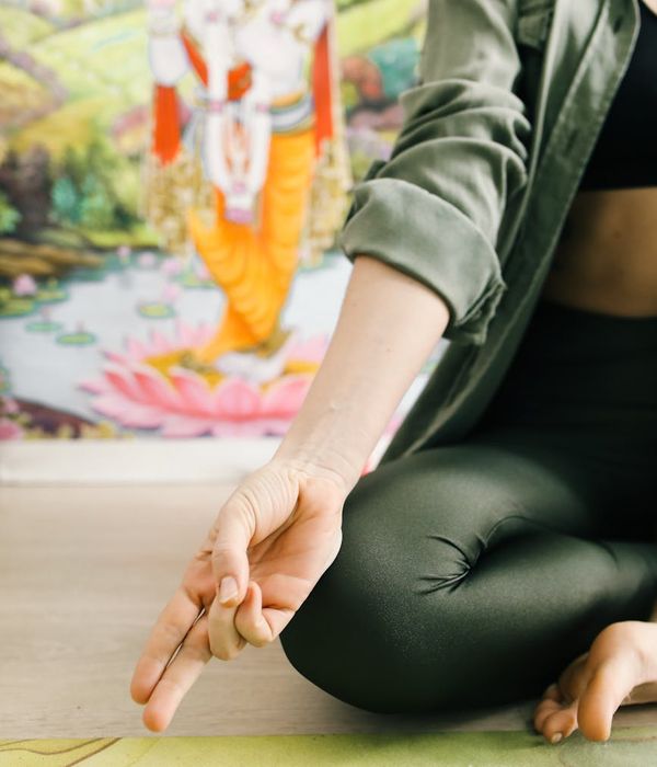 Woman in a calm yoga pose, embodying harmony and inner balance.